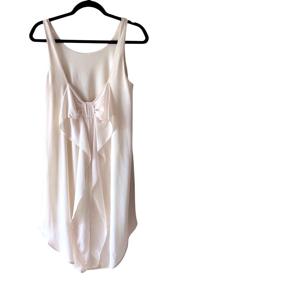 Everly Cream Sleeveless High-Low Dress with Dramatic Back Bow